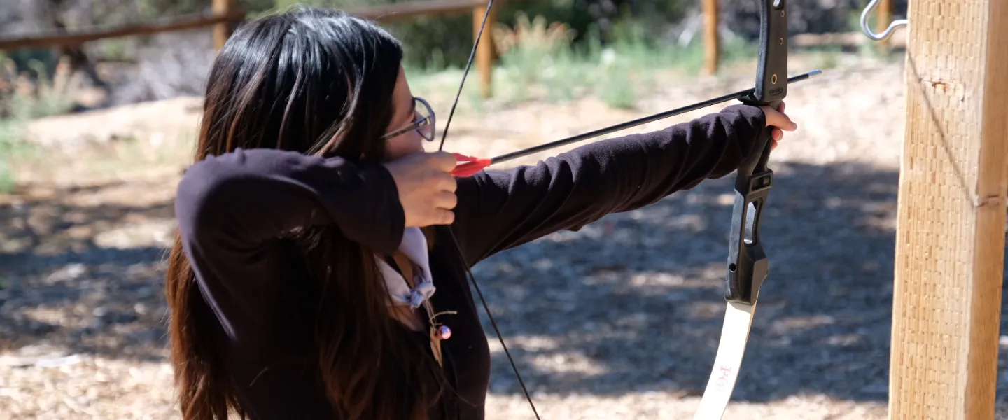 camper doing archery